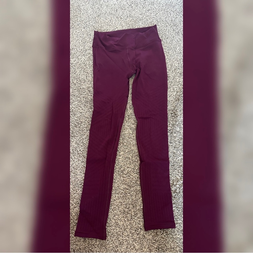 Lululemon magenta tights with mesh/cutout legs (see photos)